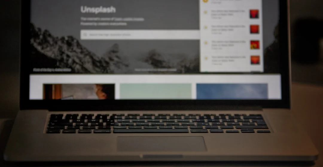 A stylish, efficient workspace featuring multiple monitors, a laptop, and a smartphone, highlighting a web design project.
